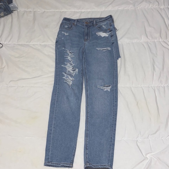 Blue ripped American Eagle jeans in size 0 - Picture 1 of 3